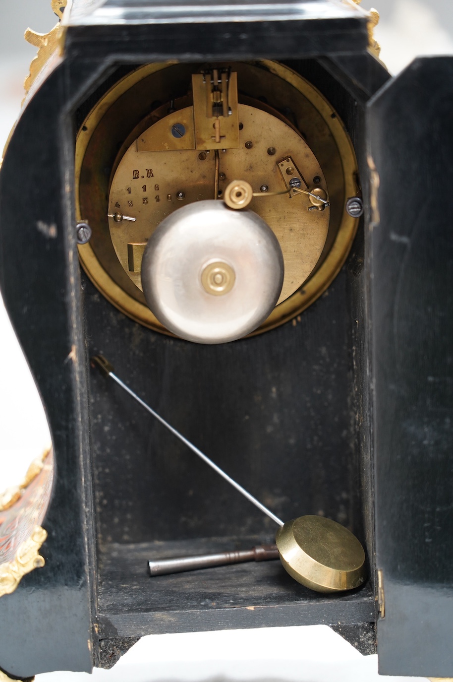 A late 19th century French boullework mantel clock, with key and pendulum, 40cm. Condition - fair to good, not tested as working